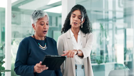 businesswomen discussing project in modern office