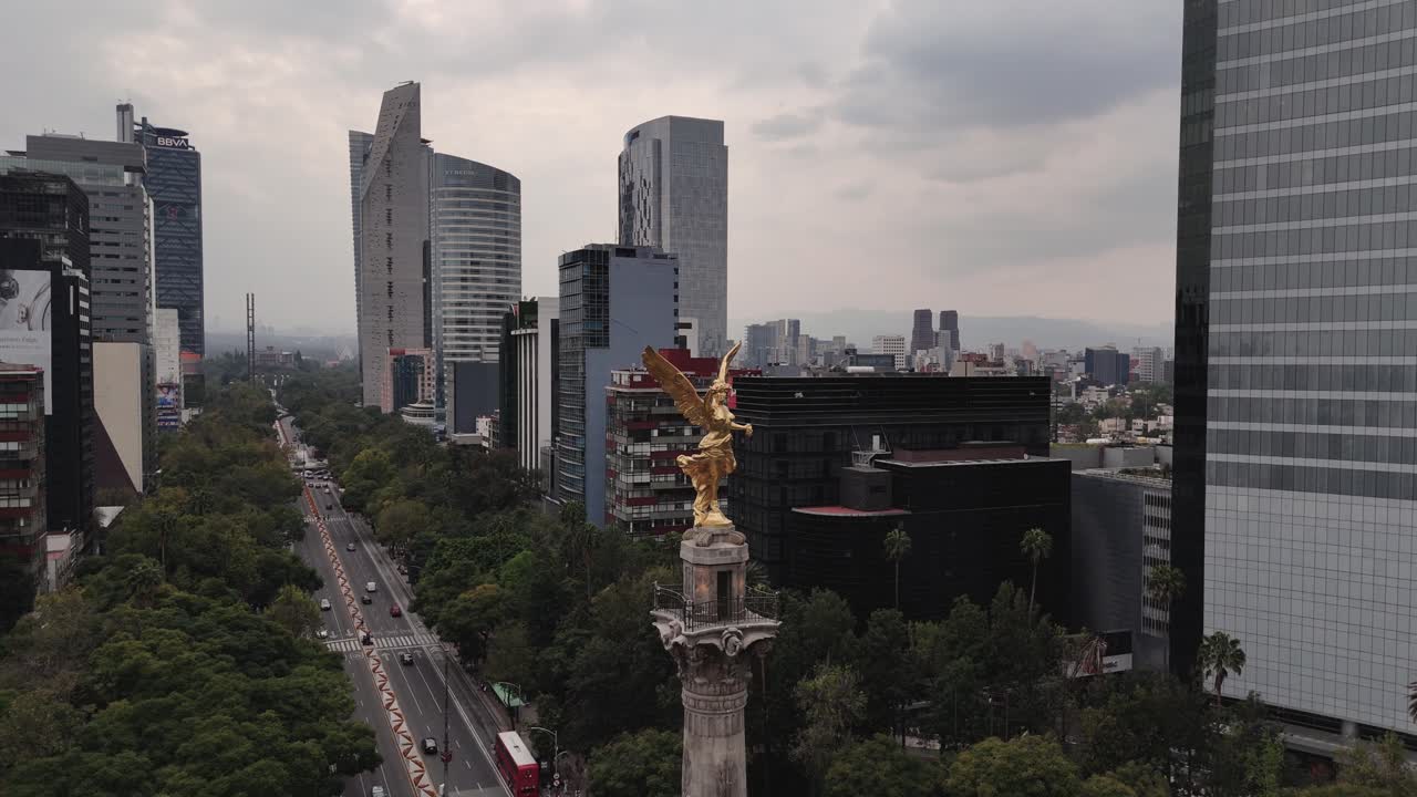 Aerial view of Angel of Independence surrounded by high-rise buildings on Paseo de la Reforma
