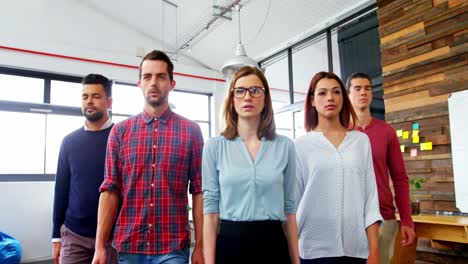 business executives walking together in office