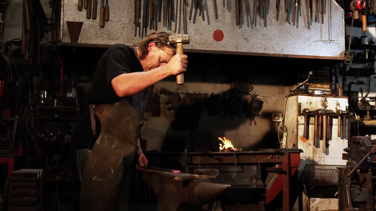 Blacksmith working on a iron rod