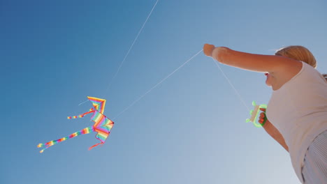 Active-Rest-On-The-Beach---Woman-Playing-With-Kite-Bottom-View