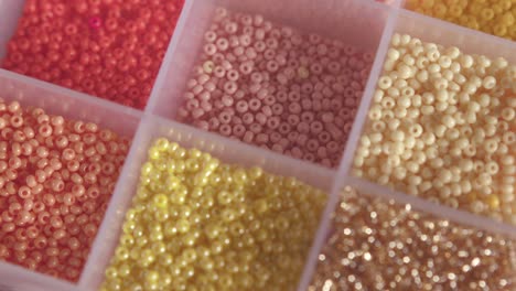 box of beads in different colors