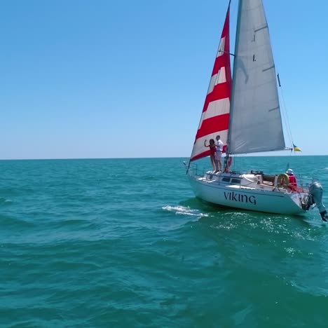 yacht sailing in open sea. aerial view of yacht sailing in the bay
