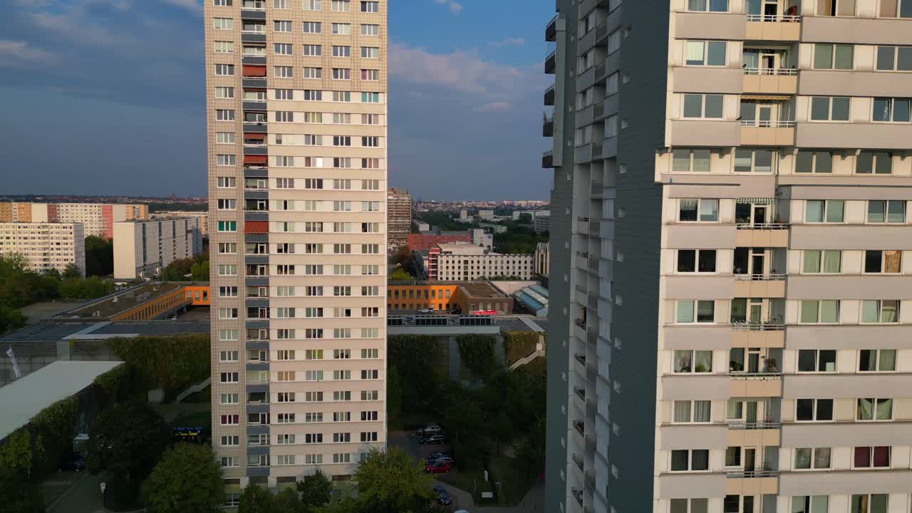 halle neustadt, a district of halle saale in germany, showing the typical plattenbau buildings at sunset. Fantastic aerial view flight very close passing flight drone