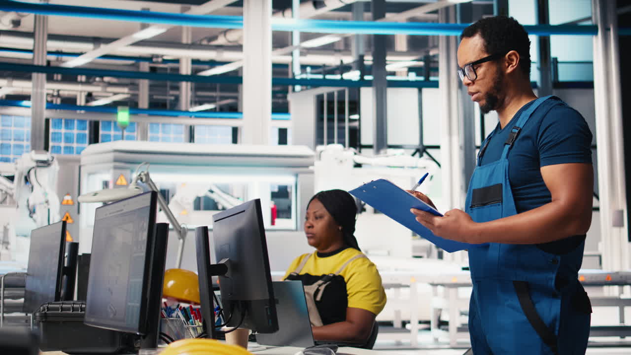 Vertical Video Portrait of engineer in photovoltaics factory reviewing paperwork