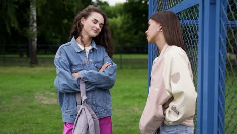 teenagers talking outdoors