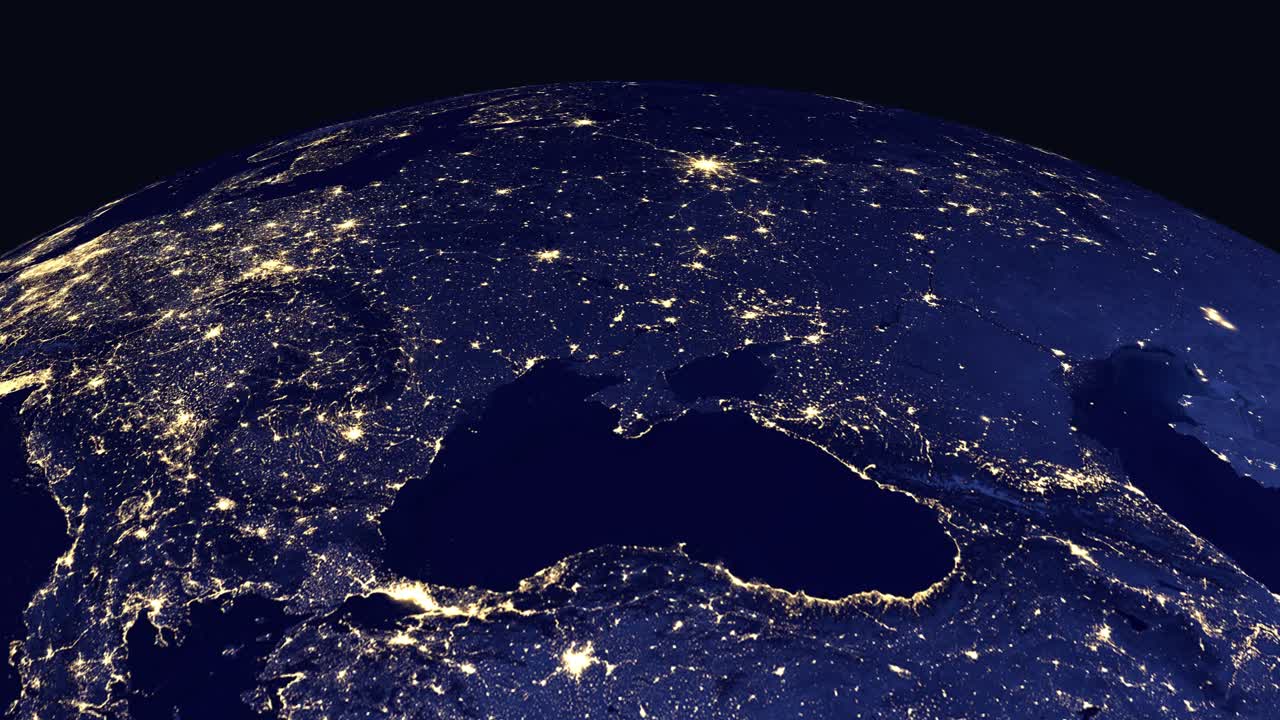 Digital globe rotates and zooms into illuminated Eastern European city lights at night from space