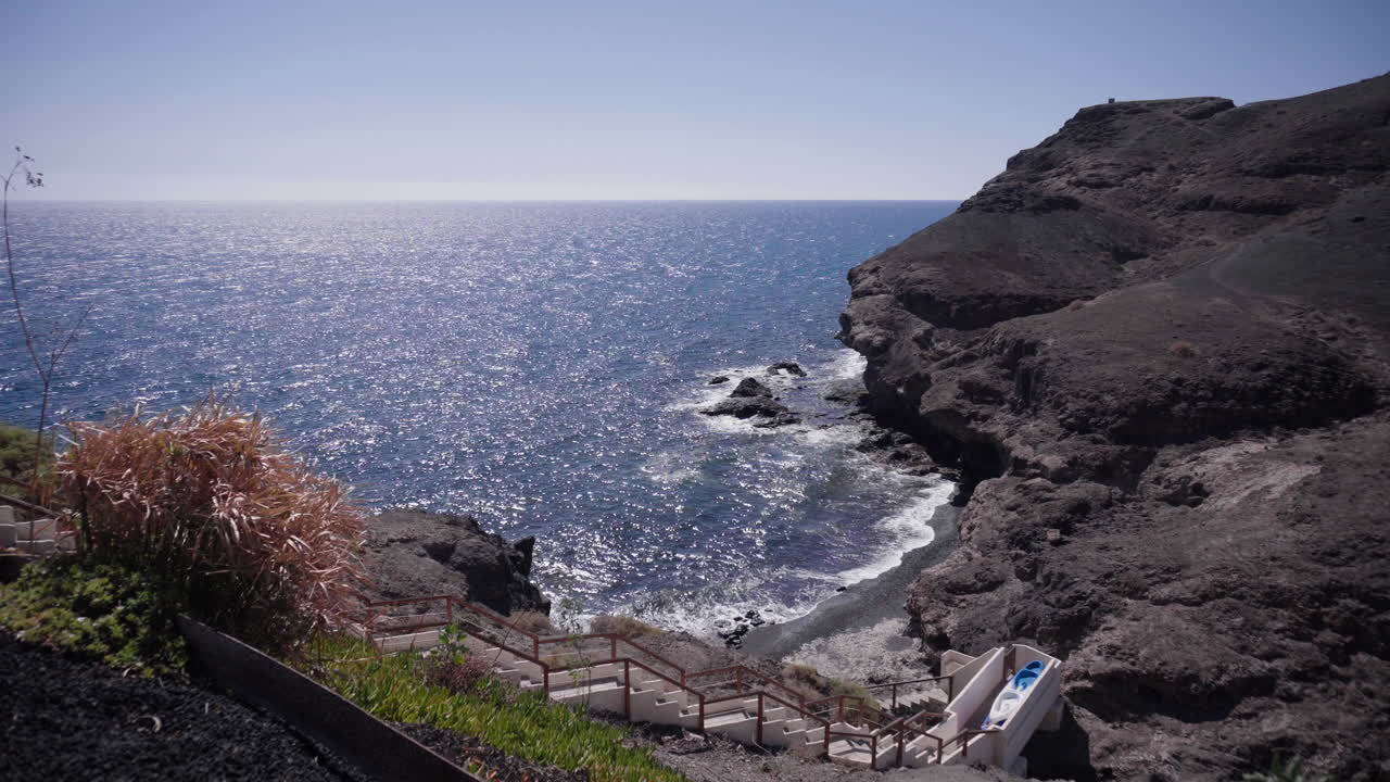 Wide view over the coast of Fuerteventura, Canary Islands with a stairs in front of the ocean