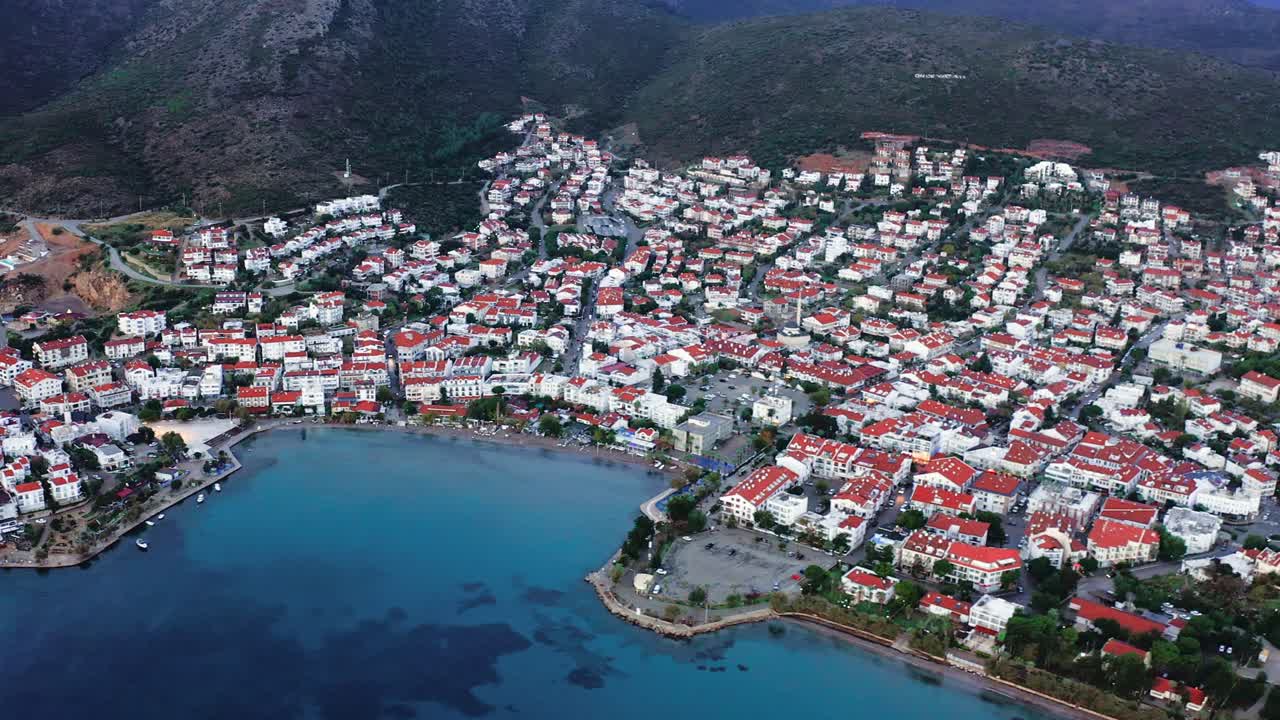 Aerial view from drone of small seaside city in Aegean Turkey at dawn