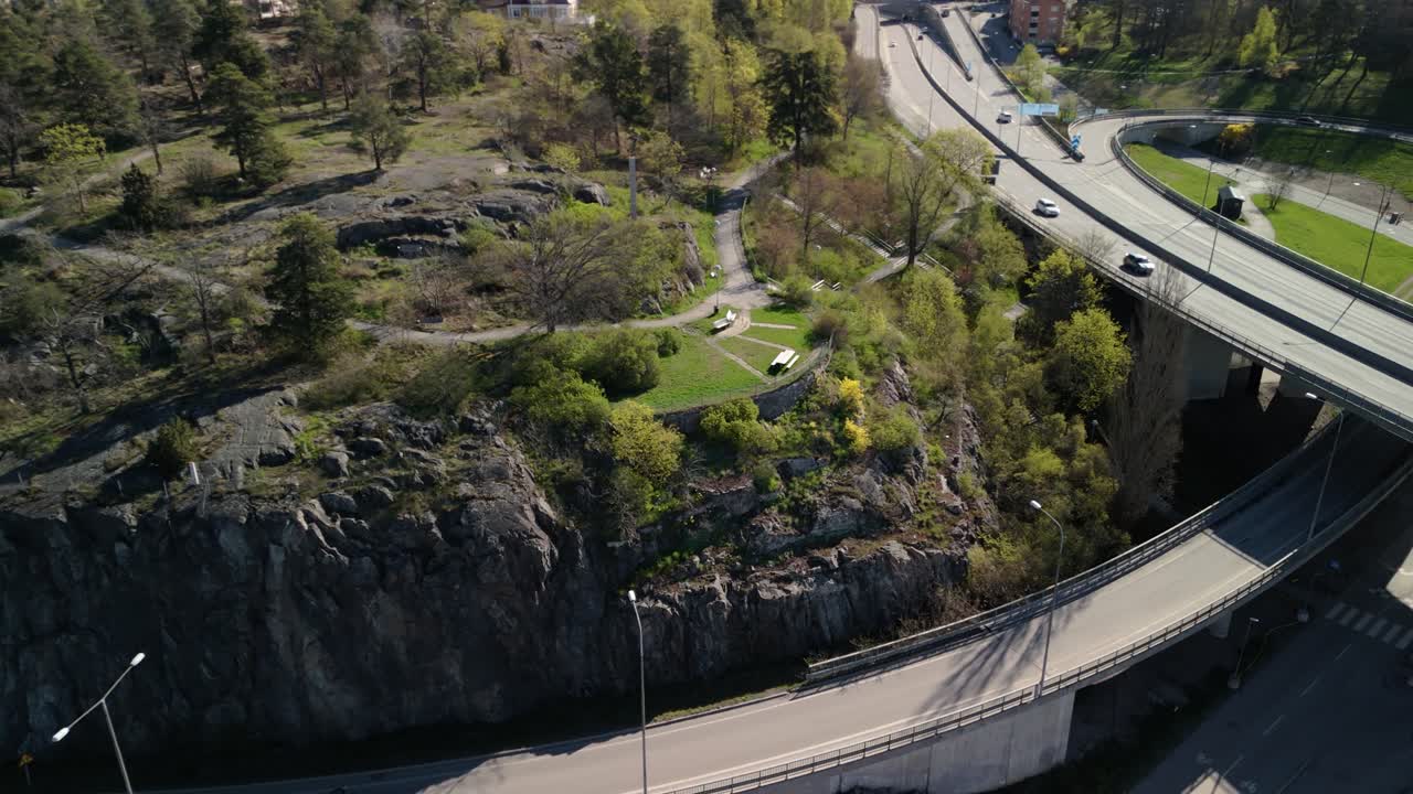 Aerial shot of a park bench by the freeway