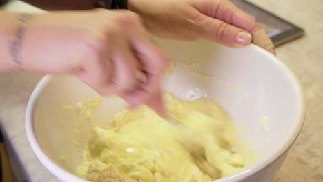 woman mixing batter in a bowl