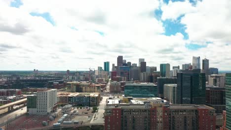 Slow-drift-down-from-the-sparkling-downtown-Denver-skyline-to-a-green-city-park