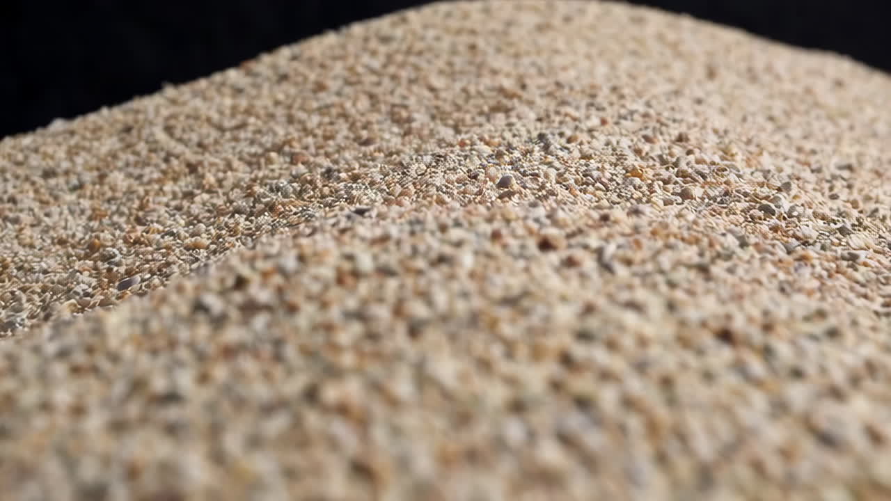 Close-up of Sand Grains with a Dark Background