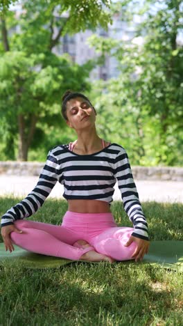 woman practicing yoga outdoors