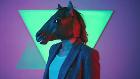 person in a horse mask wearing a business suit