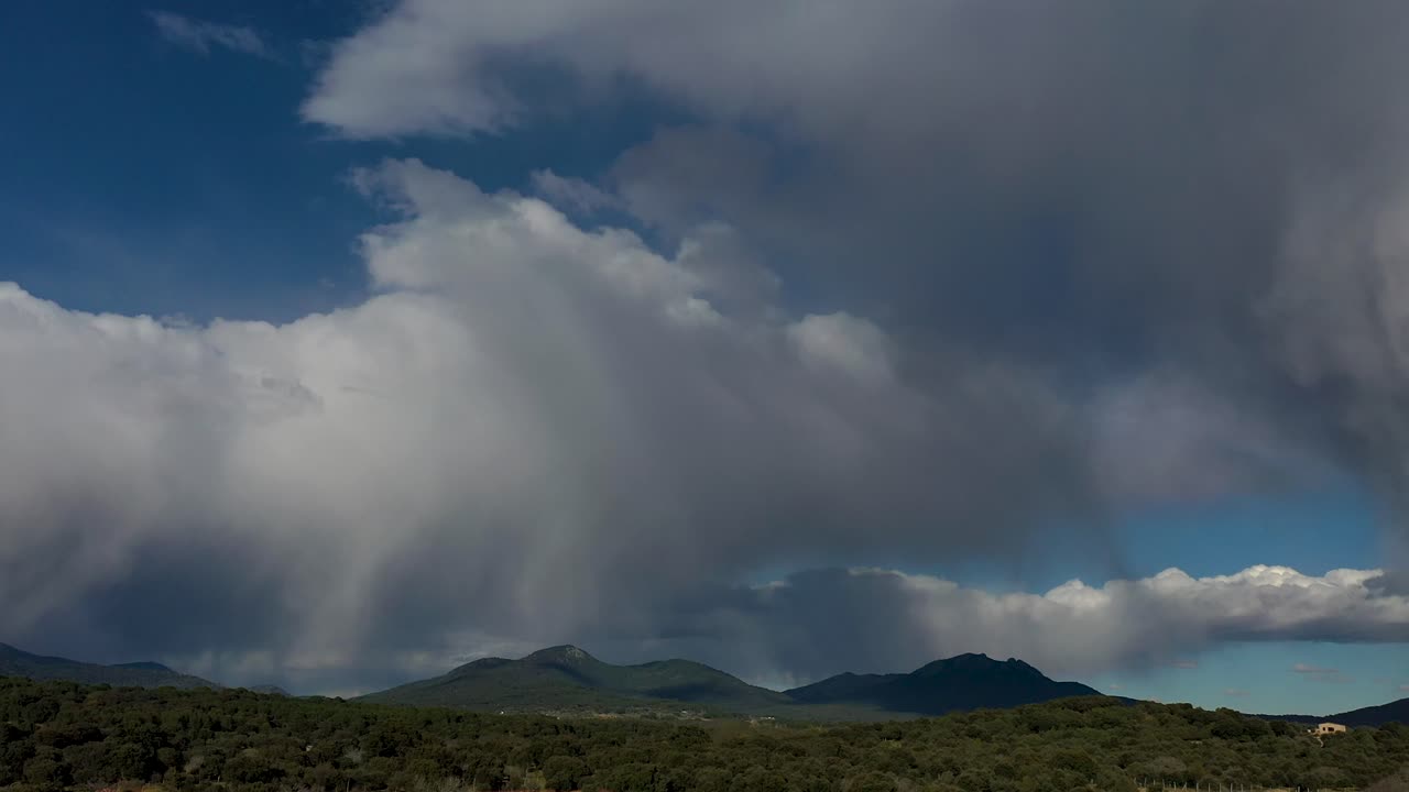 Dramatic Sky over Green Hills and Mountains