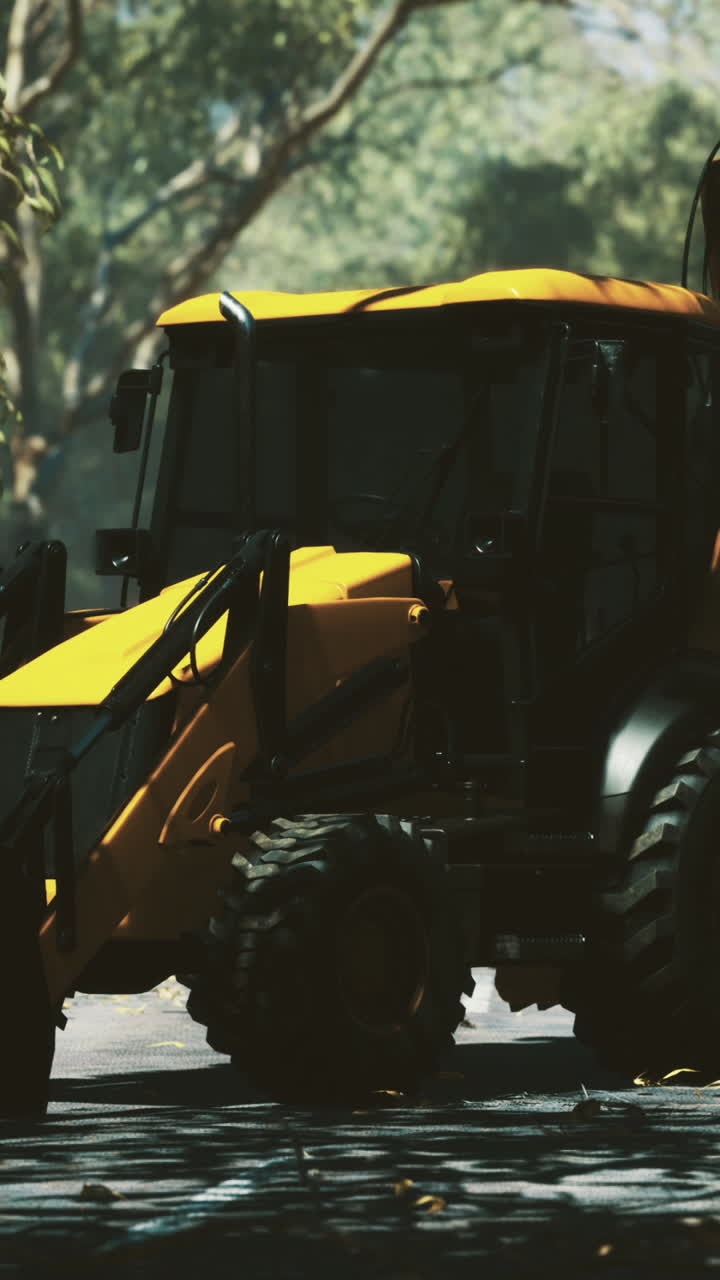 Excavator clears the path in a vibrant forest landscape at dawn
