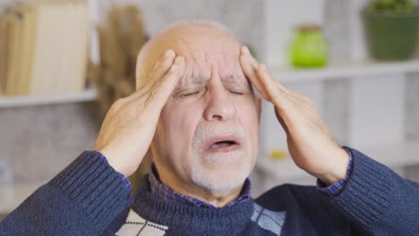 the old man has a painful headache.