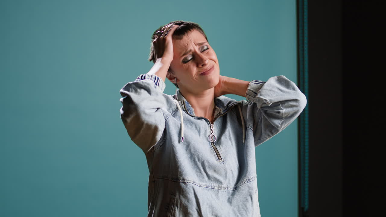 Upset woman in denim jacket