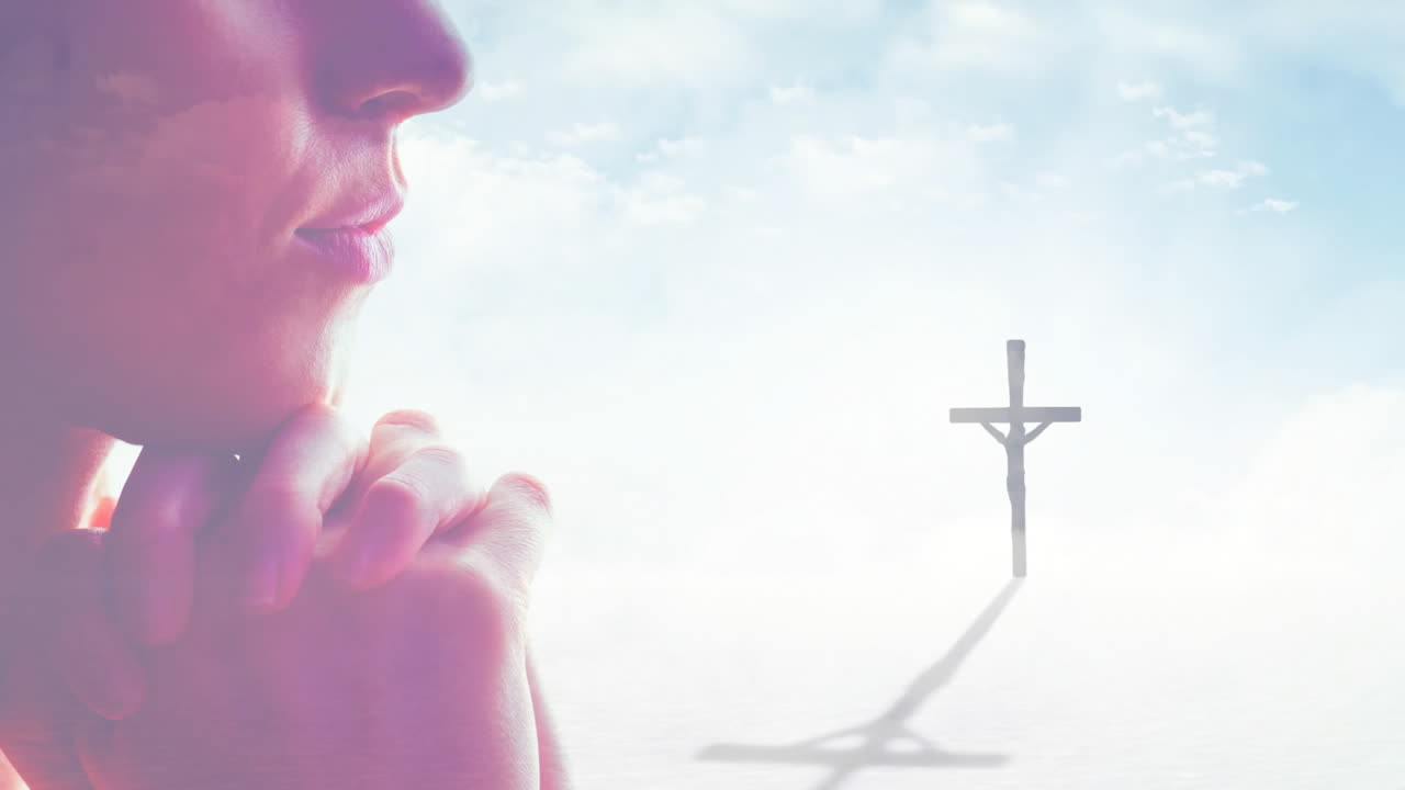 Praying person with clasped hands, cross casting shadow in background animation