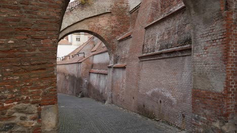 brick passage and pavement. abandoned narrow old street