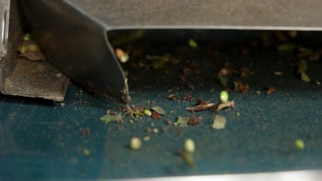 Close-up-Slow-motion-shot-of-a-peeling-beams-industrial-machine-with-beams-falling-off