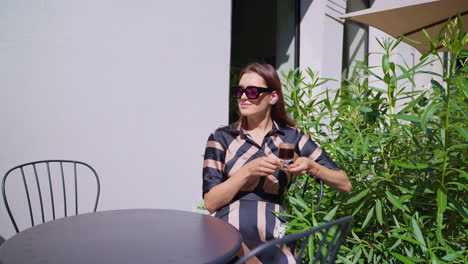 woman enjoying coffee outdoors