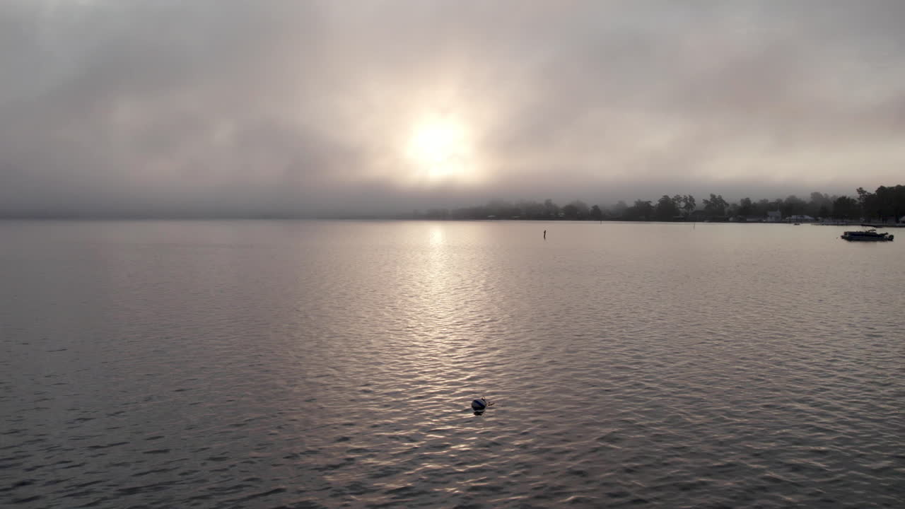 Epic sunrise on the lake with clouds, drone shot