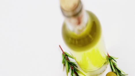 Rosemary,-green-olives-and-a-bottle-of-olive-oil