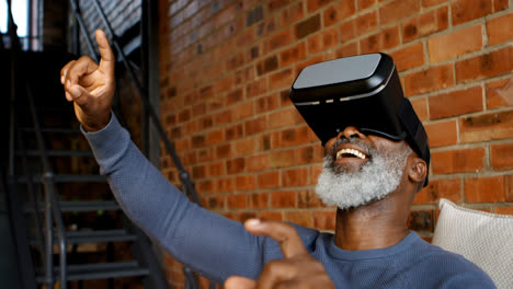 senior man using virtual reality headset in living room 4k