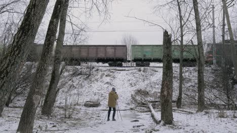 creating footage of passing freight train in winter