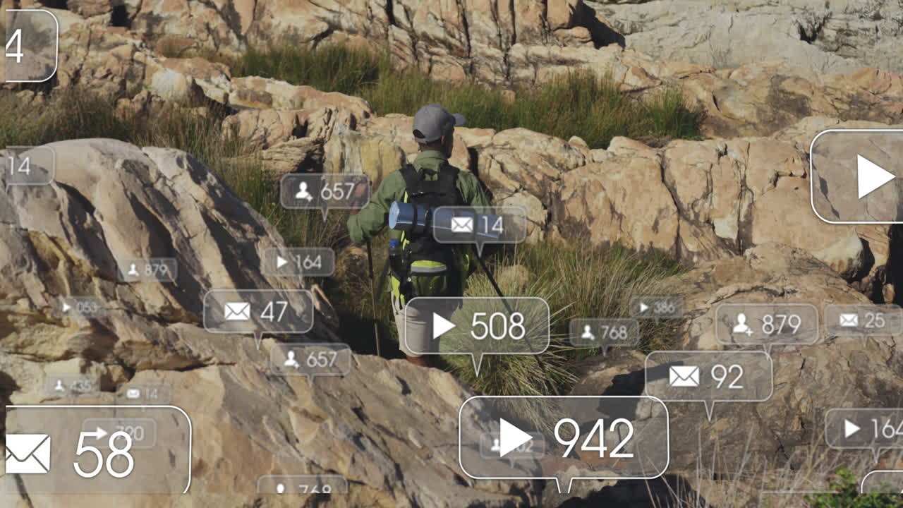 male hiker navigating canyon, floating social media icons showing view follower message counts