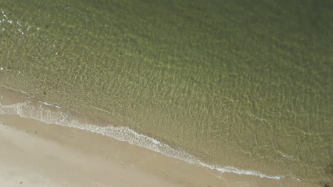 serene beach with pristine water at sunrise