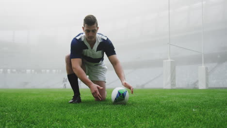 male rugby player tying shoelaces in the stadium 4k