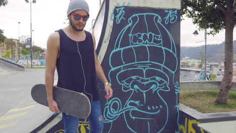 Young-boy-using-skate-board-in-a-street-park