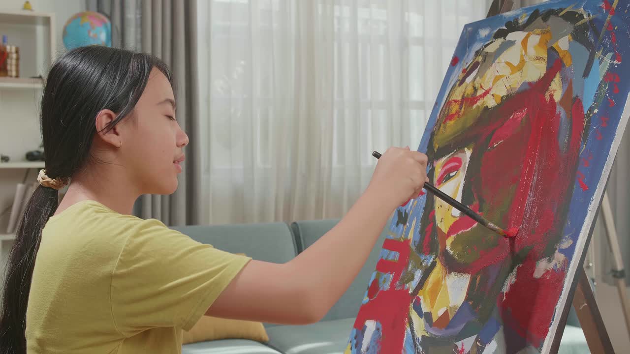Medium Shot Side View Of An Asian Artist Girl Holding Paintbrush Mixed Colour And Thinking Before Painting A Girl'S Hair On The Canvas