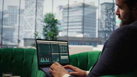 vertical video determined ceo works in office analyzing infographics and setting business goals