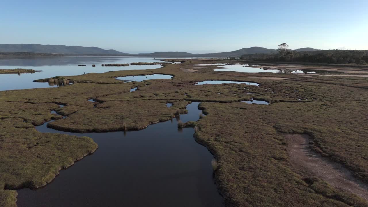 Panoramic aerial view over the wetlands of the Moulting Lagoon Game Reserve in Coles Bay, Tasmania