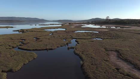 panoramic aerial view over the wetlands of the moulting lagoon game reserve in coles bay, tasmania