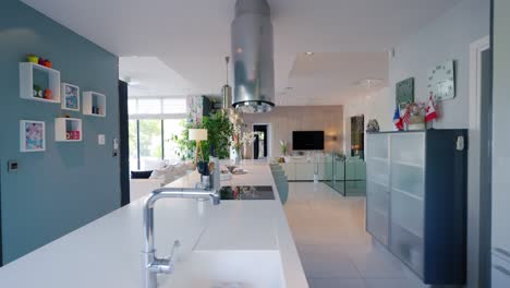 slow revealing shot of a breakfast bar within a kitchen in a home in st gely du fresc