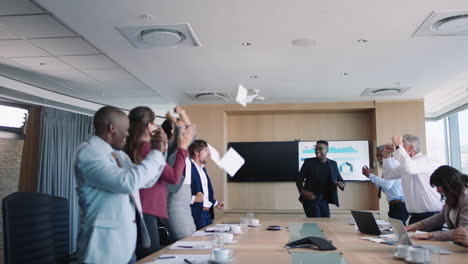 crazy-business-people-celebrating-in-boardroom-successful-corporate-victory-colleagues-throwing-papers-excited-applause-in-office-meeting-enjoying-winning-success-4k