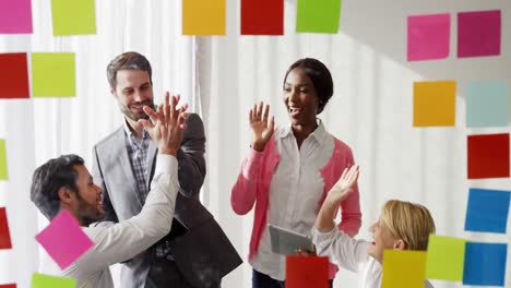 Businesspeople-giving-high-five-to-each-other