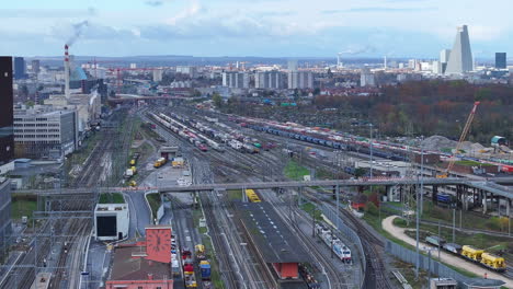 muttenz cargo train depot with the skyline of basel in the background