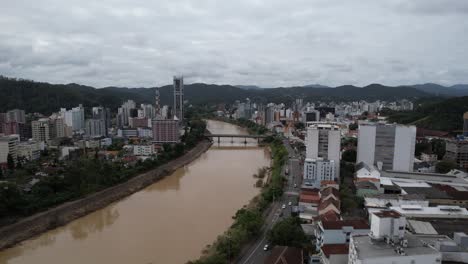 aerial-view-of-the-Itajaí-Açu-river,-Blumenau,-city-in-the-Itajaí-valley,-state-of-Santa-Catarina,-southern-Brazil