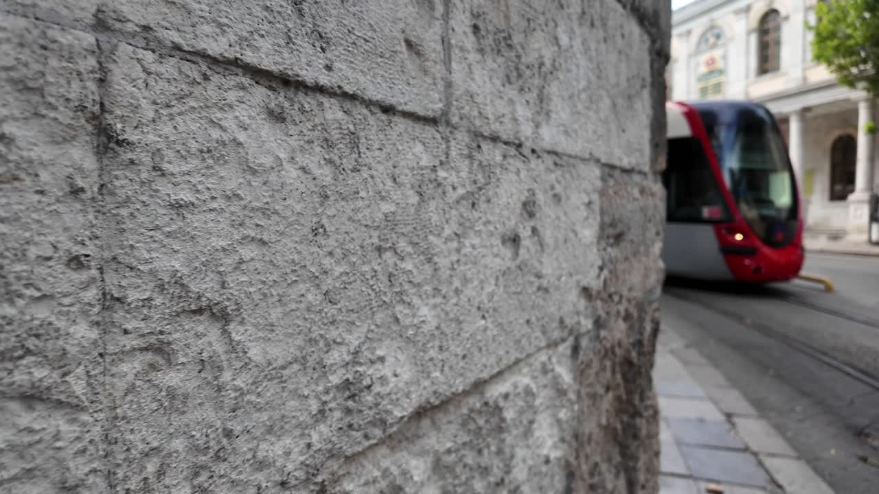 Urban Scene with Stone Wall and Tram