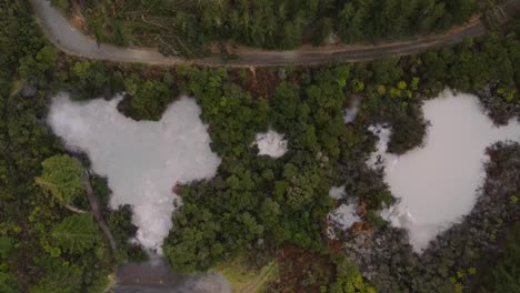 Aerial-view-of-Waiotapu-Mud-Pool,-hot-spring-in-active-geothermal-area,-New-Zealand