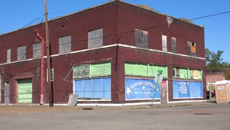 An-old-abandoned-building-stands-in-a-dusty-and-run-down-small-town-in-Mississippi-America