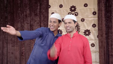 Two-muslim-men-laughing-on-someone