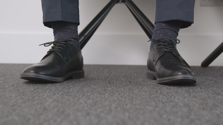 Close Up Of Feet Of Male Candidate Waiting In Office Before Job Interview 1