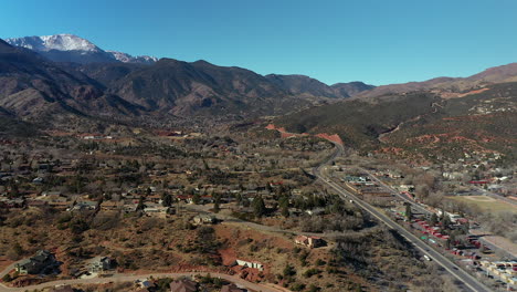 Aerial-drone-footage-over-highway-twenty-four,-heading-to-Manitou-Springs,-in-Southwest-Colorado-Springs,-Colorado